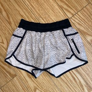 Black and white 4” length lulu lemon short size 6